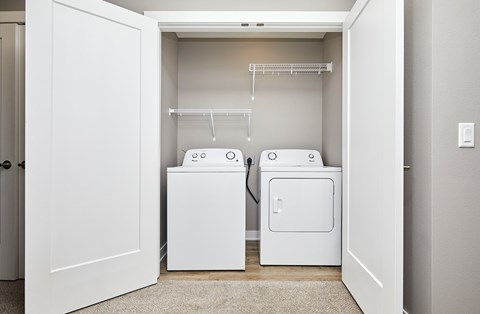 A laundry room with a washer and dryer.
