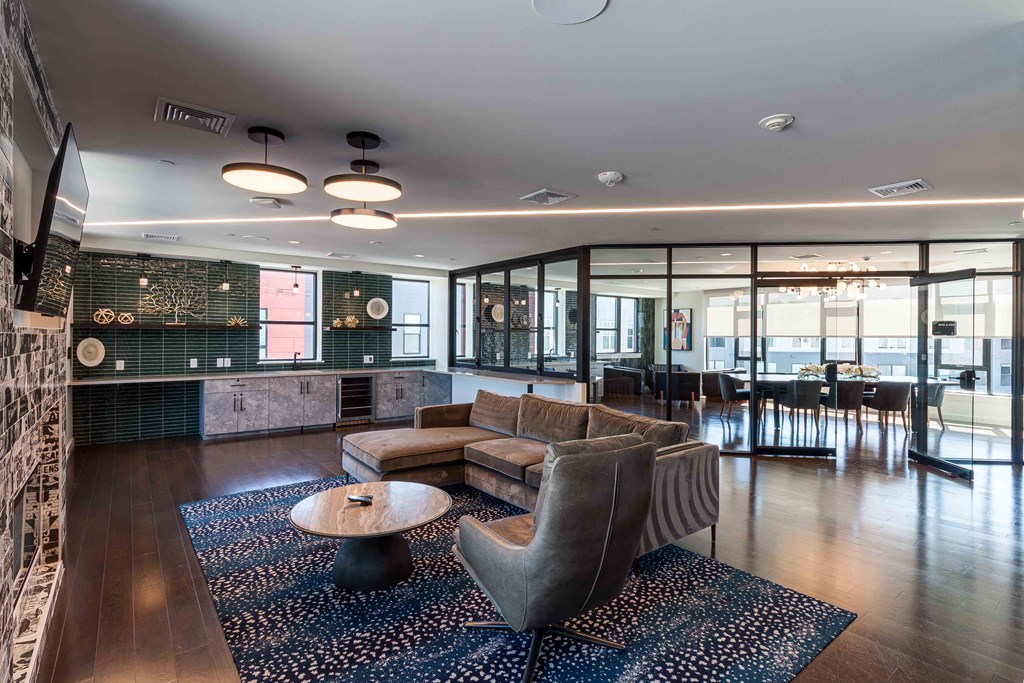 A modern living room with a large sofa and a coffee table.