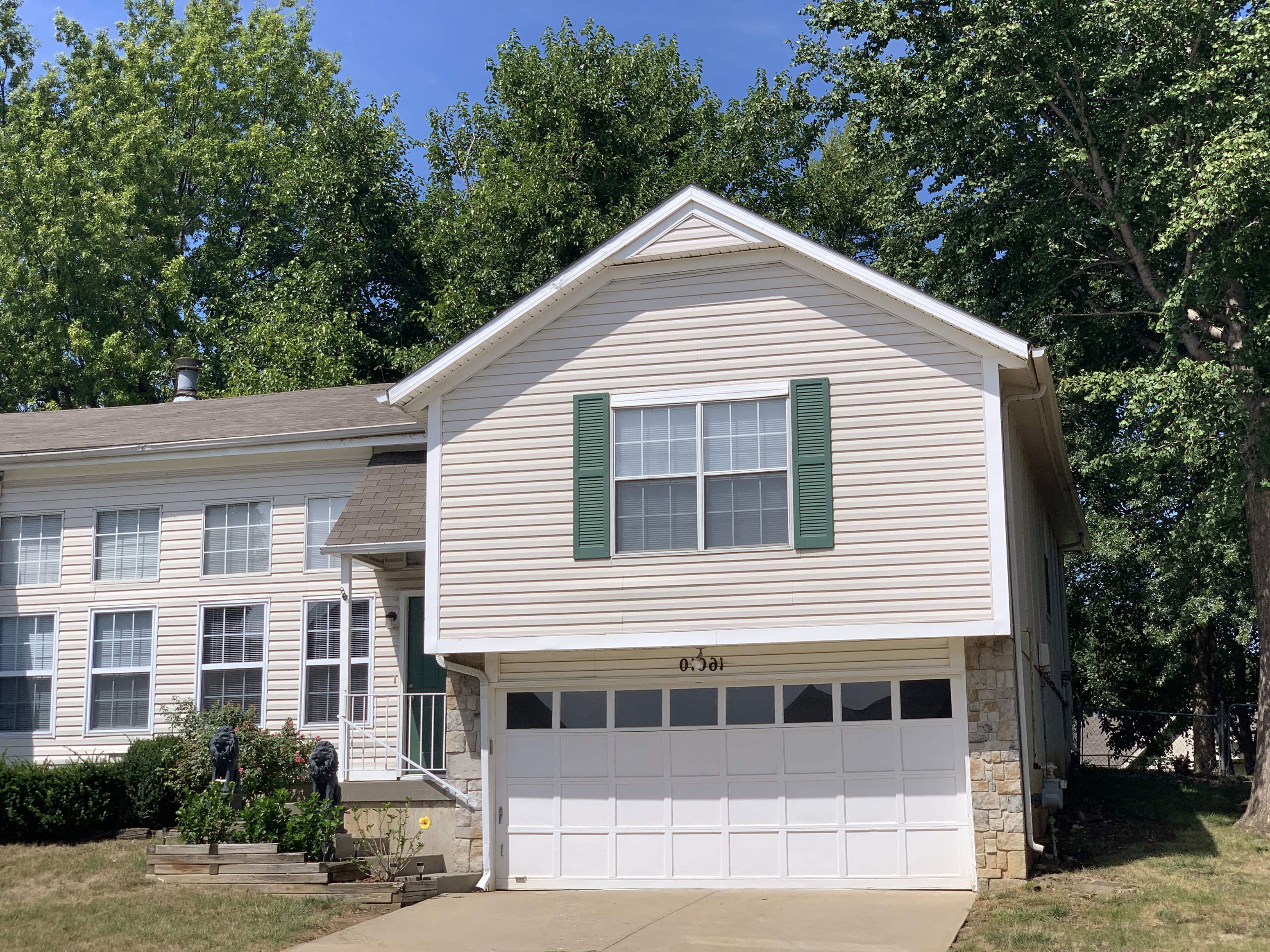 a white house with a white garage door