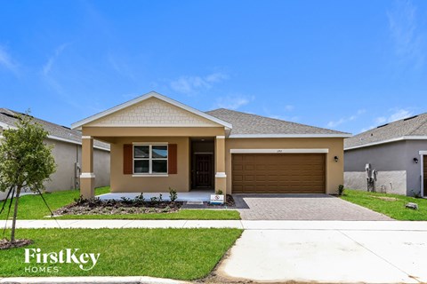 a house with a driveway and a garage door