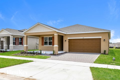 a house with a driveway and a garage door