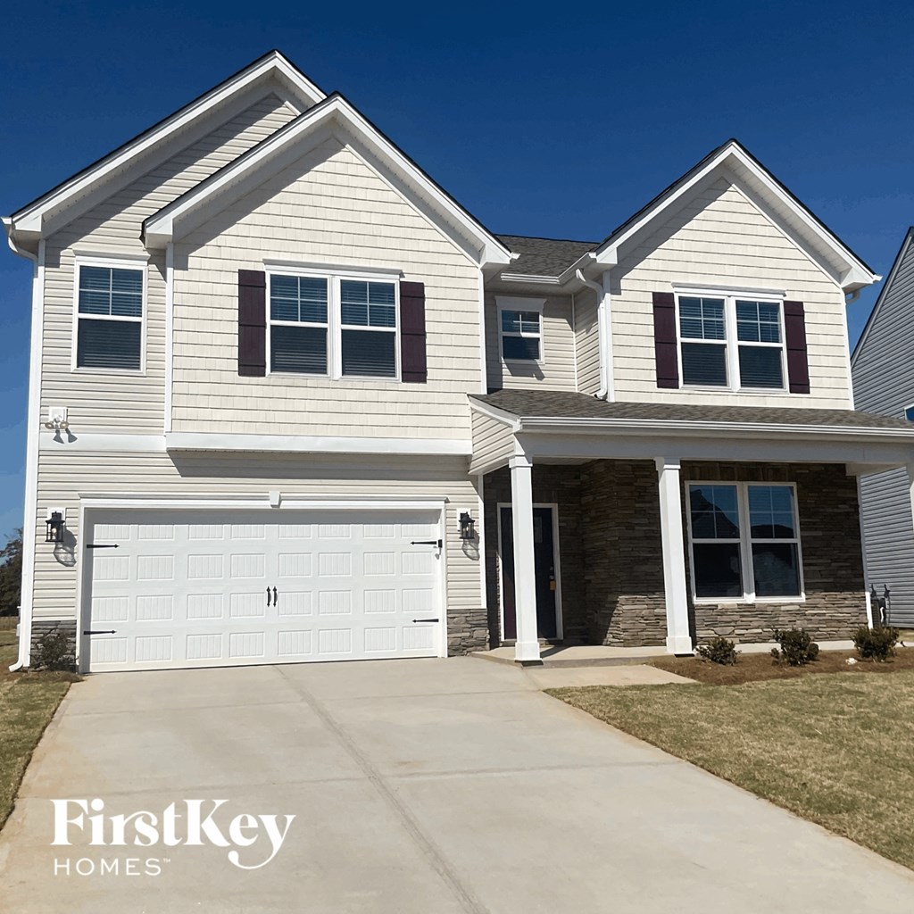 a white house with a white garage door