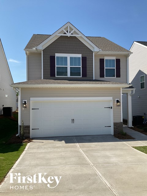 A two-car garage is attached to a house.