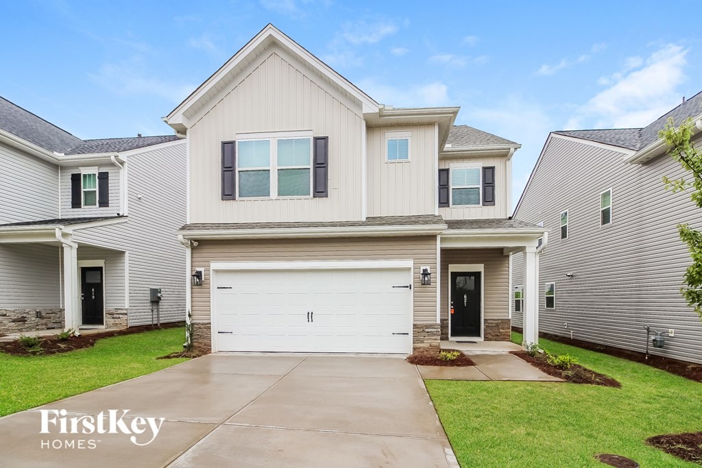 A house with a garage is for sale by FirstKey Homes.
