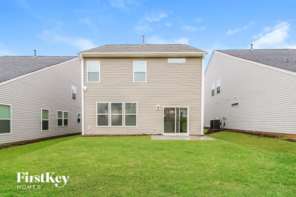 A house with a lawn in front of it is for sale.