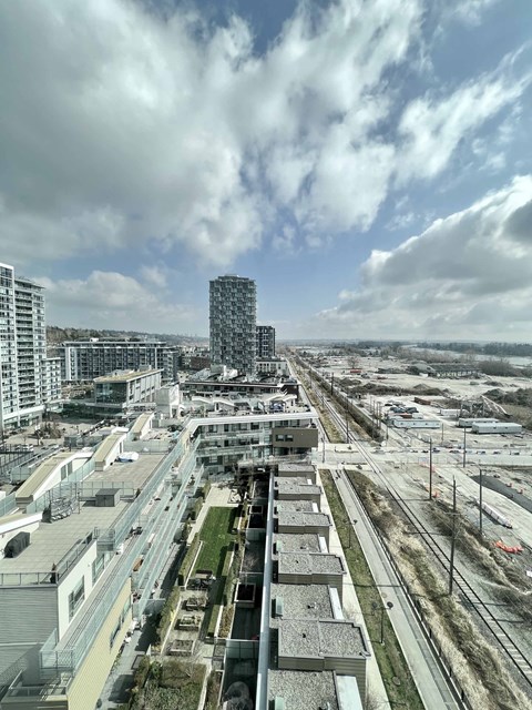 A cityscape with a mix of residential and commercial buildings.