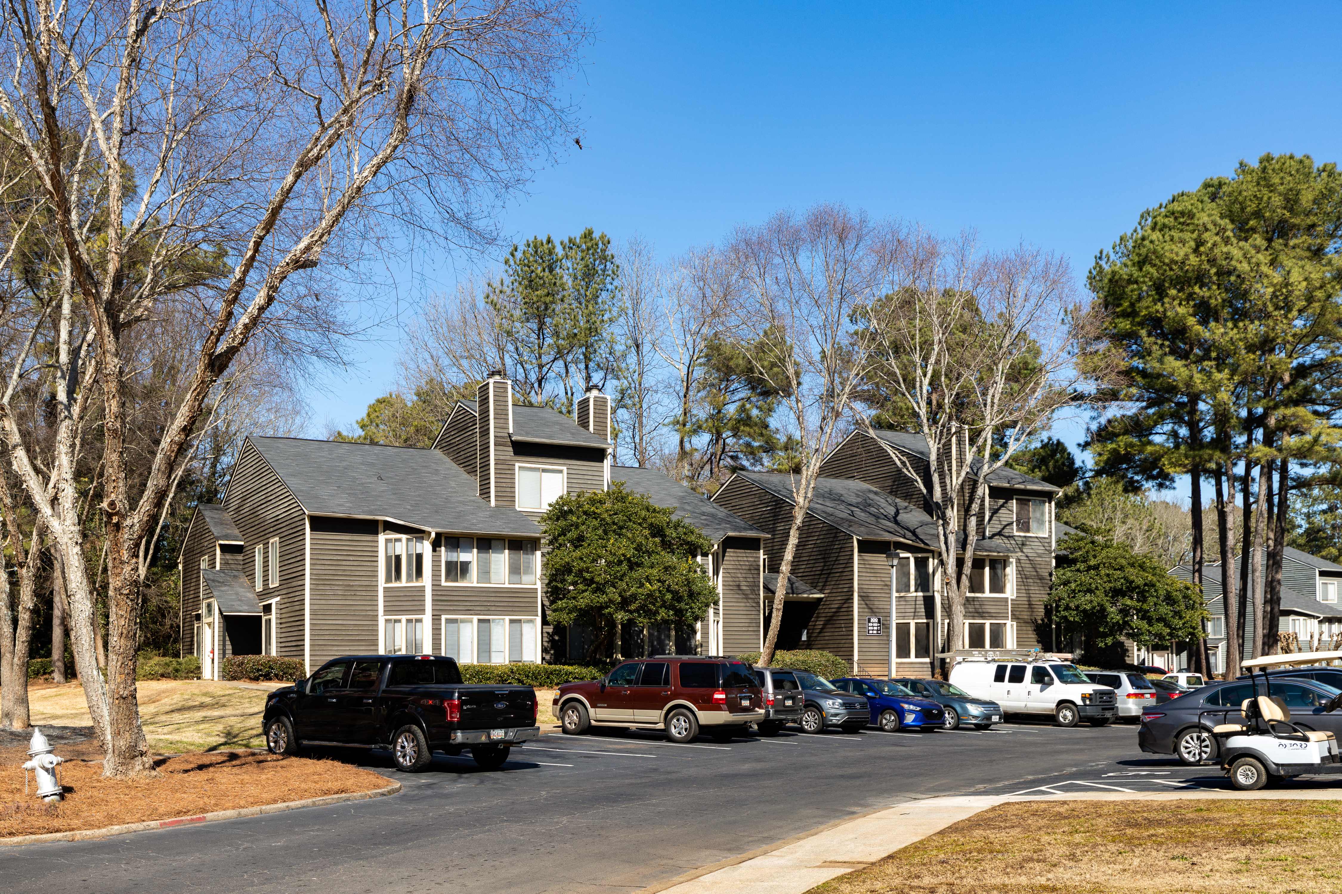 a group of houses on the side of a street