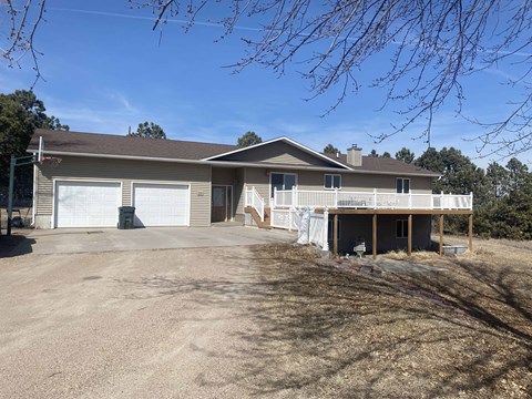 a large house with a driveway and a garage door