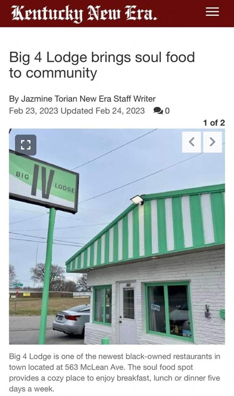 a screenshot of a street sign in front of a building
