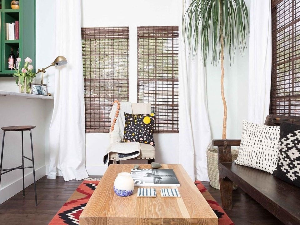 a living room with a chair and a coffee table