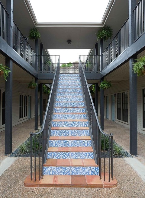 a set of stairs with blue tiles on it
