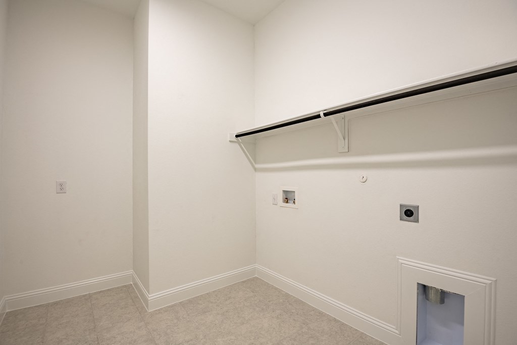 a empty room with a white wall and a garage door