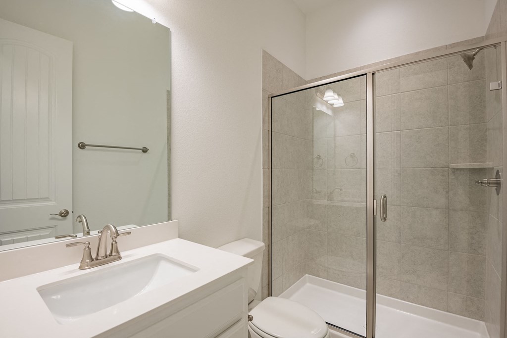 a bathroom with a sink toilet and a shower