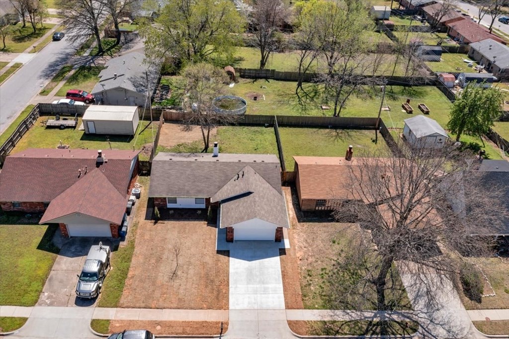 an aerial view of a neighborhood with houses and a cemetery