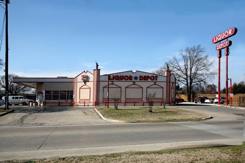 A liquor depot building with a red and white sign.