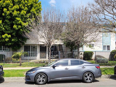 a car parked in front of a house