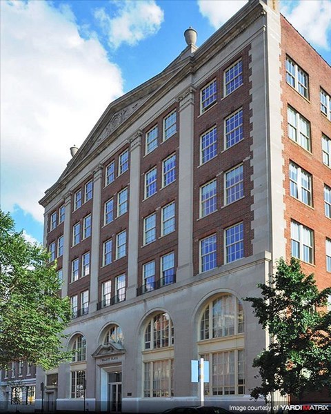 a large brick building with many windows on it