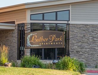 a building with a sign for butter park apartments