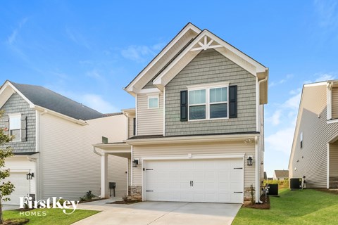 A house with a garage is for sale by FirstKey Homes.