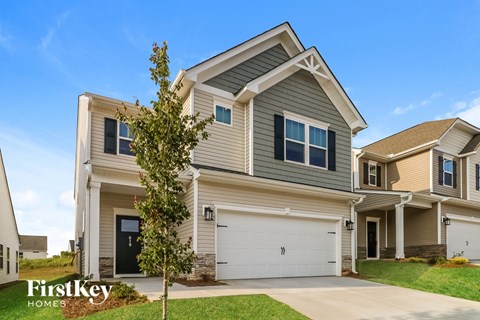 A house with a garage is for sale by FirstKey Homes.