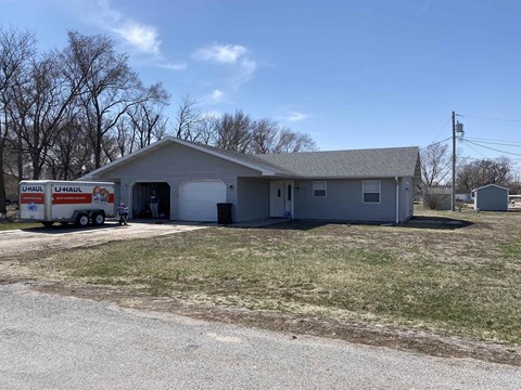 a house with a truck parked in front of it