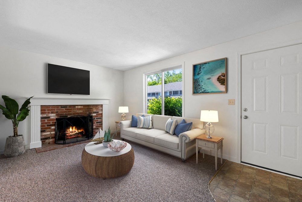 a living room with a couch and a fireplace