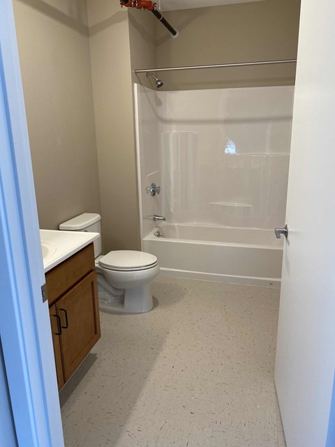 a bathroom with a toilet sink and bathtub