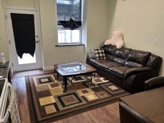 a living room with a leather couch and a table