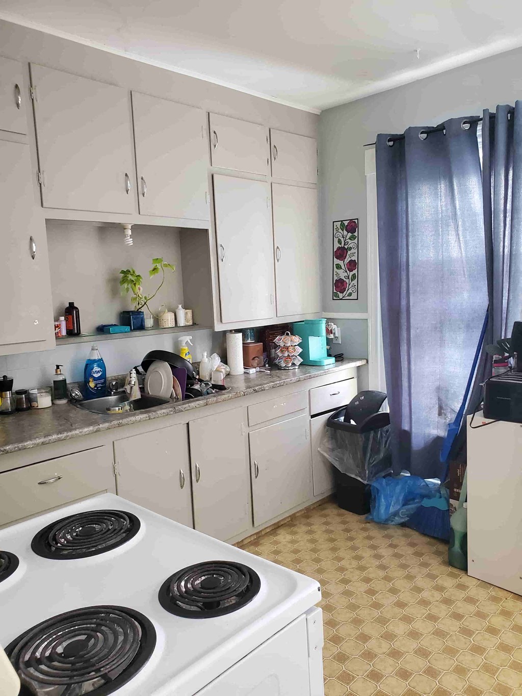 a white stove top oven sitting in a kitchen