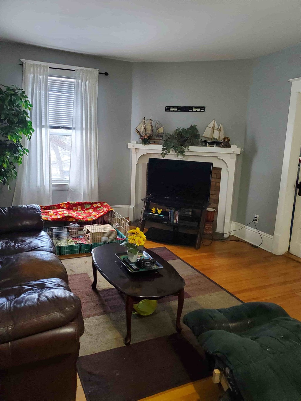 a living room with a couch a table and a tv