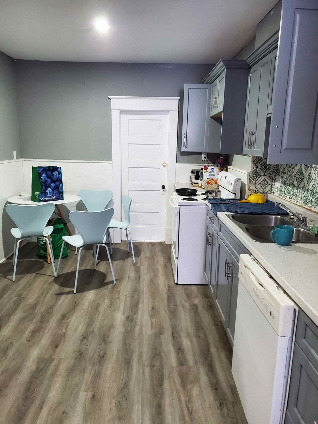 a small kitchen with a table and chairs in it