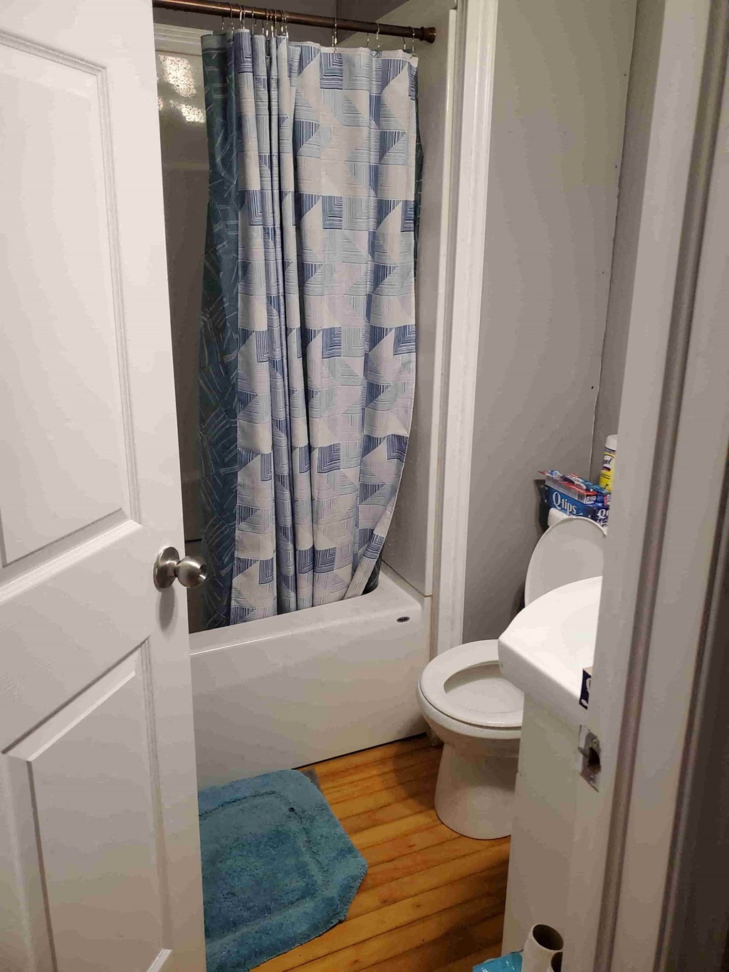 a small bathroom with a toilet and a shower