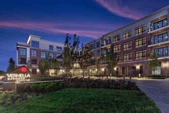 a rendering of the exterior apartments at night