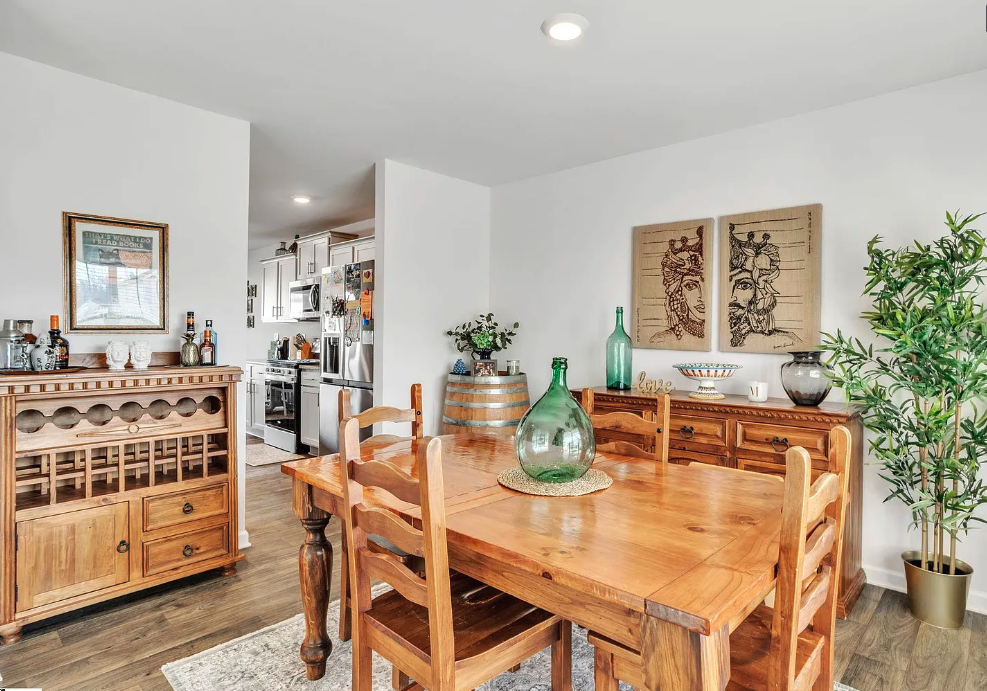 the dining room is open to the kitchen and living room