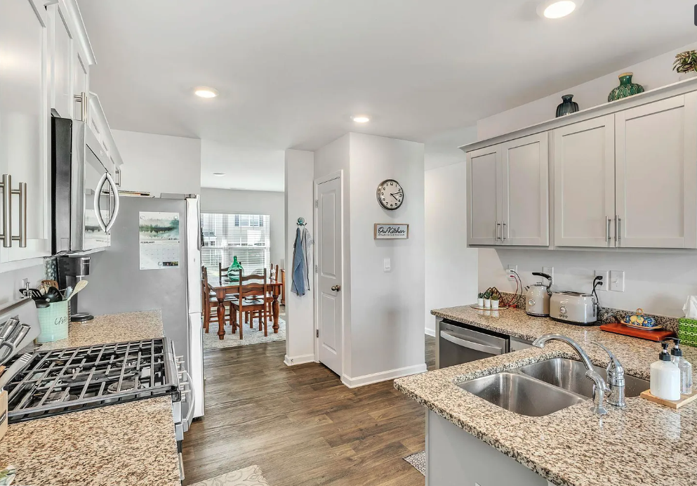 a kitchen with granite counter tops and a sink