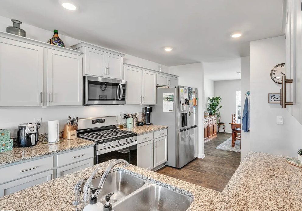 a kitchen with a sink and a refrigerator