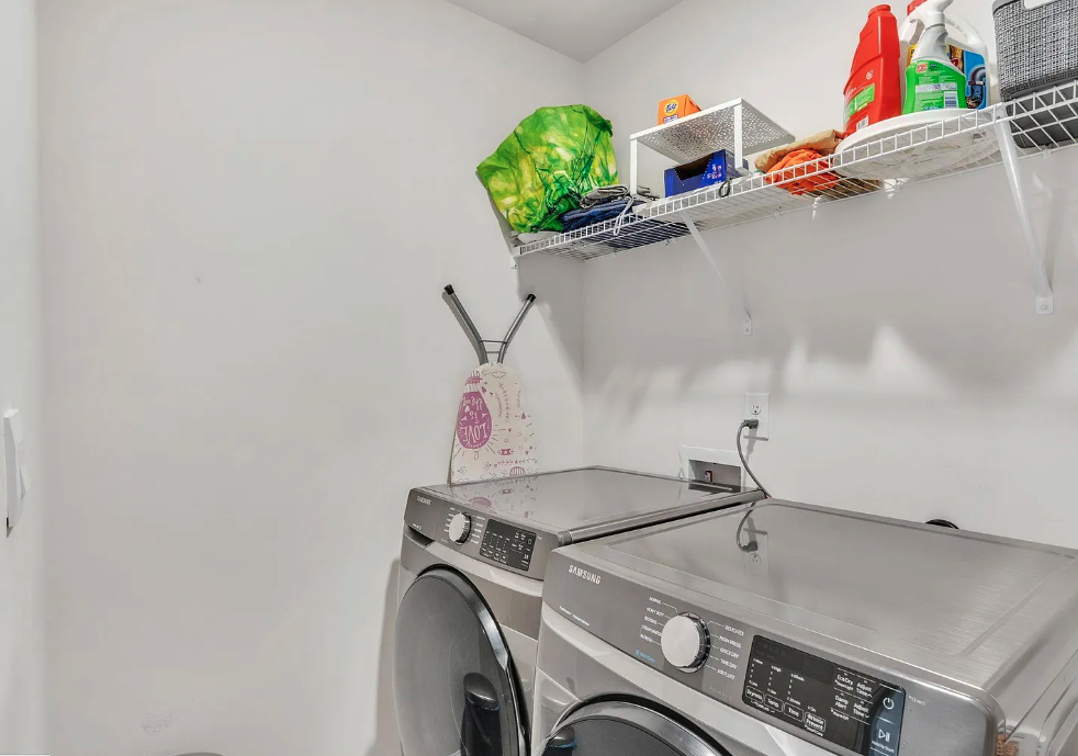 the laundry room has a washer and dryer in it