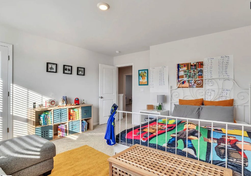 a bedroom with a bunk bed and a closet