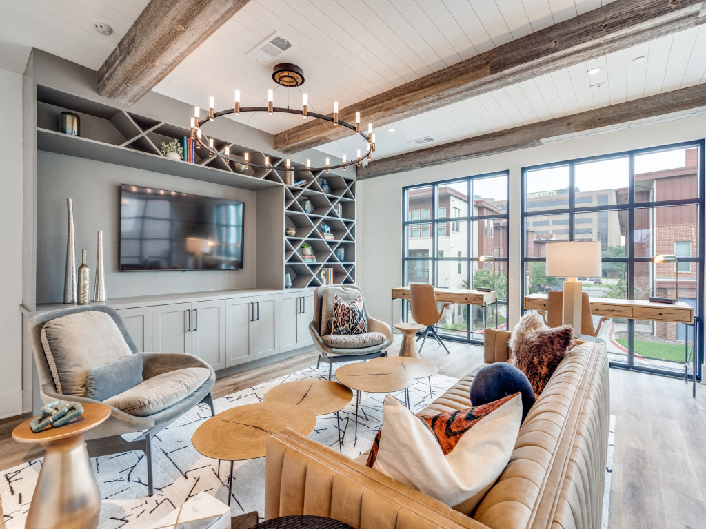 a living room with a couch and chairs