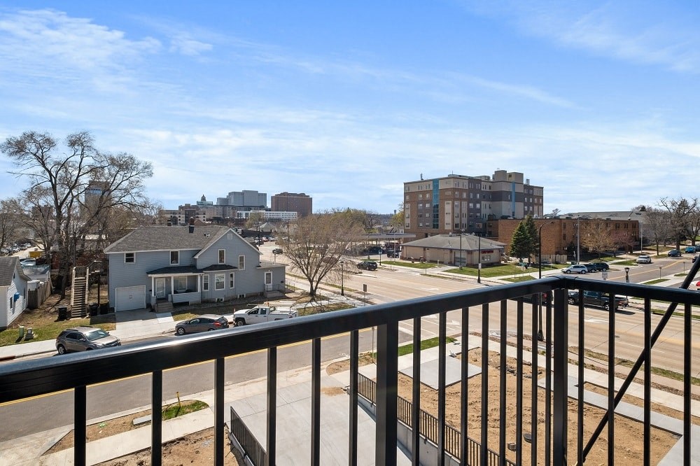 the view from the balcony of a condo in a city