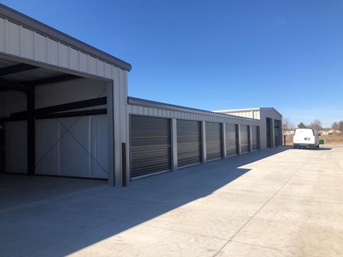 A long row of closed grey garage doors.