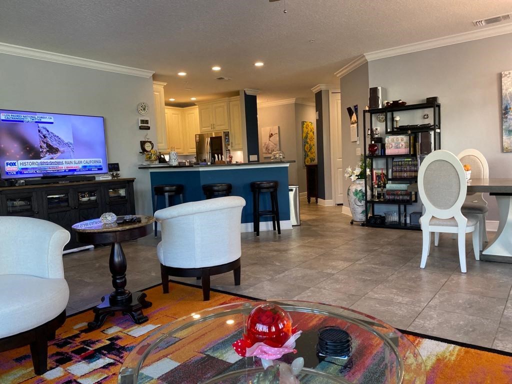 a living room with a tv and a table