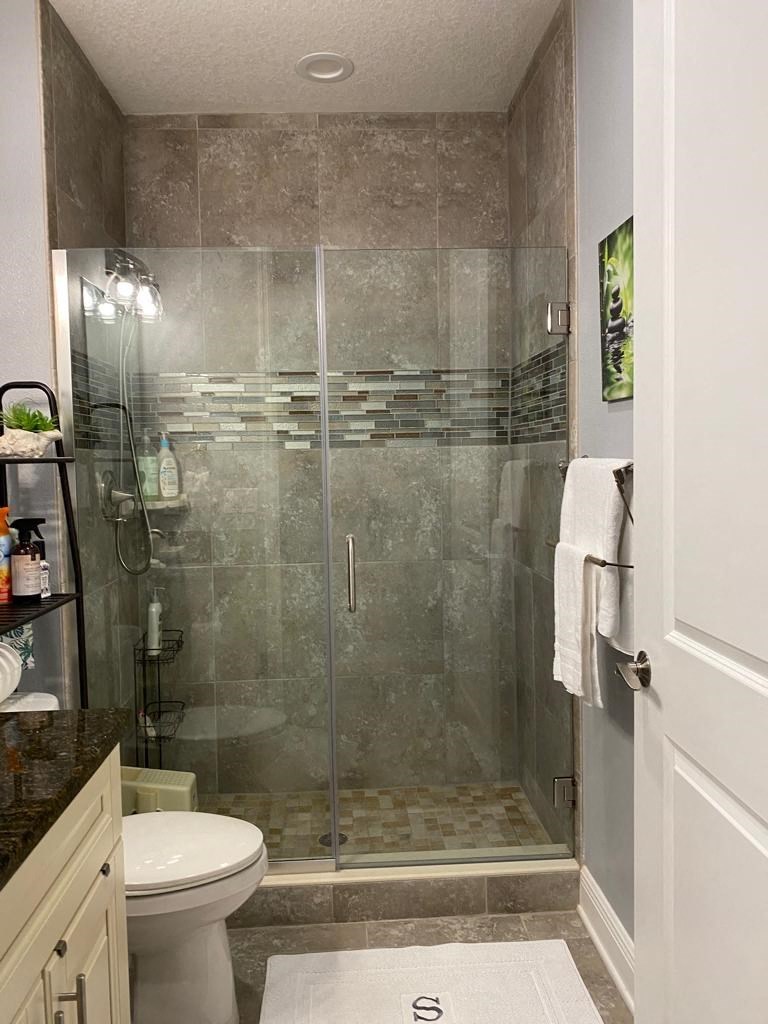 a small bathroom with a shower and a toilet