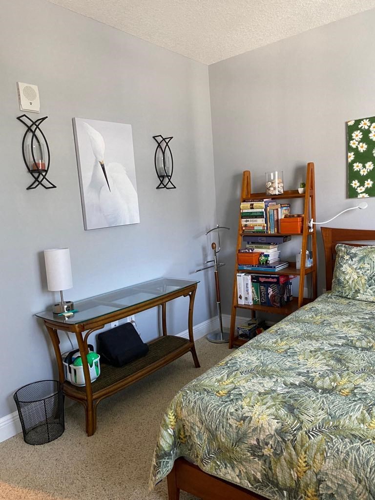 a bedroom with a bed and a table in it