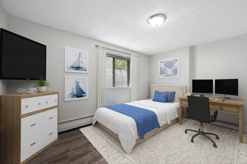 a bedroom with a bed and a tv