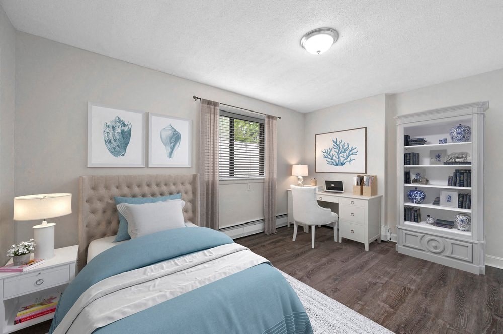 a bedroom with a bed and a desk