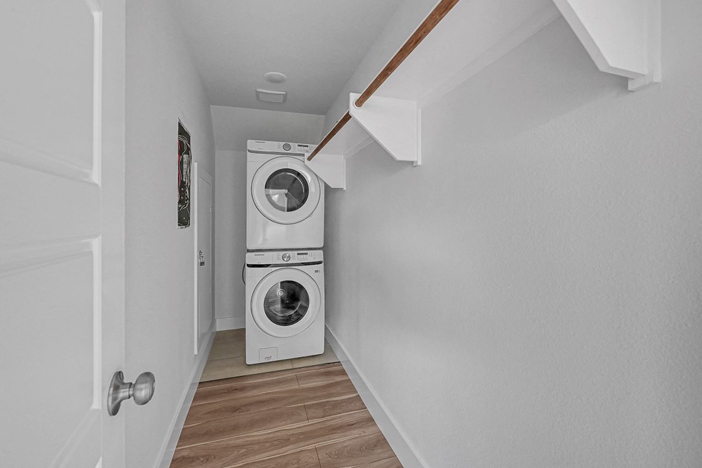 a small laundry room with a washing machine and a dryer