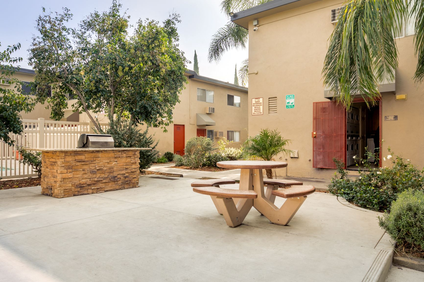 Luxury Apartments in Canoga Park for Rent - Parthenia Terrace - BBQ with Counter Space and Landscaping Around.
