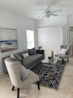 A living room with a grey couch, a chair and a coffee table.