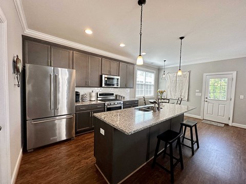 a kitchen with stainless steel appliances and a granite counter top
